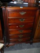 A six drawer mahogany chest with brass drop handles. COLLECT ONLY.