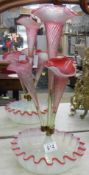 A Victorian opaque and cranberry glass epergne.