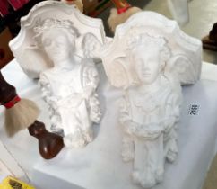 2 large plaster wall mounts with cherub faces