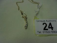 A diamond pendant set brilliants and two yellow diamonds on a 9ct gold chain, 1.6 grams.