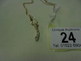 A diamond pendant set brilliants and two yellow diamonds on a 9ct gold chain, 1.6 grams.
