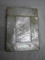 An engraved mother of pearl card case.