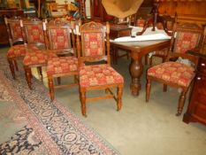 A large oak wind out table with ten matching chairs, (122cm x 240cm x 72cm high) COLLECT ONLY.