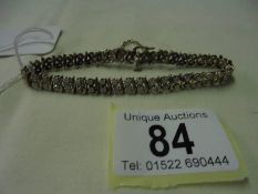 A 9ct gold bracelet set diamonds stones, total weight 11.9 grams. (19cm in length)