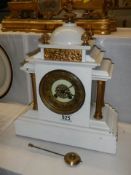 An Edwardian slate mantel clock, in working order.