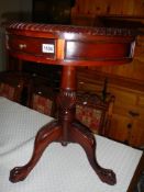 A mahogany single drawer tripod table. COLLECT ONLY.