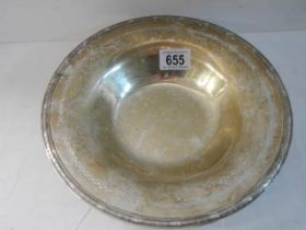 A sterling silver dish, 25 cm diameter. 300 grams.