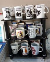 Over 20 cat themed mugs including 4 of Felix the cat