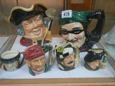 Two large and four small Royal Doulton character jugs.
