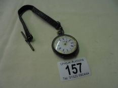 A Victorian ladies silver fob watch on a leather strap.