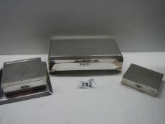Three vintage silver plate cigarette boxes.