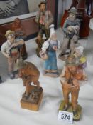 Eight good old carved wood figures.