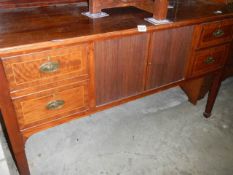 A late Victorian mahogany sideboard with two shelves and four doors. COLLECT ONLY.