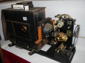 An unusual large projector and a Magic Lantern projector. COLLECT ONLY.