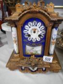 A late 19th century French mantel clock with Sevres panels, spring ok but missing hands.