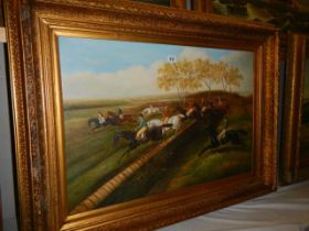 A gilt framed oil on canvas painting of a steeplechase, frame 118 x 88 cm, image 89 x 59 cm, COLLECT