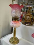 A Victorian oil lamp with glass font and original cranberry glass shade, no damage, COLLECT ONLY.