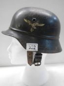 A WW2 German Luftwaffe beaded helmet stamped NS64 DN30 with 'Ski Div Jungvolki' on liner