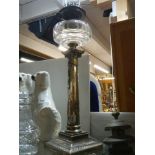 A Victorian silver plate Corinthian column oil lamp in good condition.