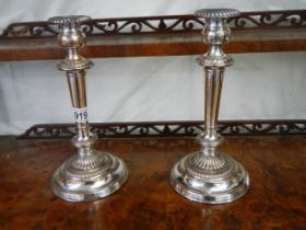 A pair of Sheffield plate candlesticks.