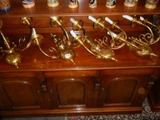 Four good quality matching double brass wall lights.