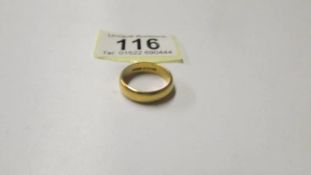 A 22ct gold wedding ring, size O, 7 grams.