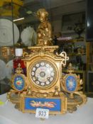 An old French mantel clock with Sevres panels, in working order.