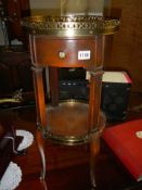 A circular mahogany table with brass gallery. COLLECT ONLY.