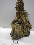A cast bronze figure of an elderly lady, 18cm