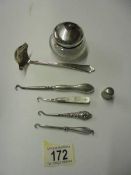 3 silver handled button hooks, silver & mother of pearl button hook, a silver sauce ladle,