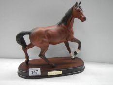 A Beswick 'Spirit of the Wind' horse on plinth.