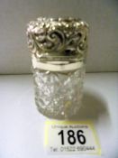A Birmingham 1897 Charles May silver topped cut glass jar.