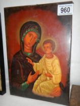 An icon on wood depicting the Madonna with child.