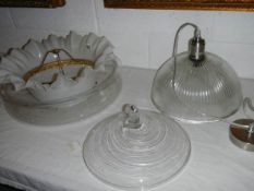 A quantity of glass lamp shades.