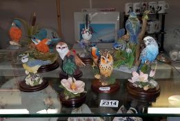 A collection of bird figures including Country Artists