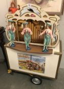 A good travelling organ on stand with carrying case, all figure move, playing tapes from organ music