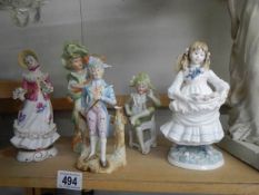 Five porcelain figurines including Coalport.