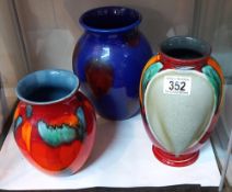 Three Poole Pottery vases.
