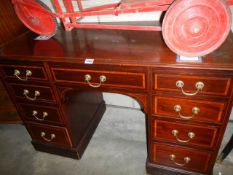 A mahogany inlaid kneehole desk, COLLECT ONLY.