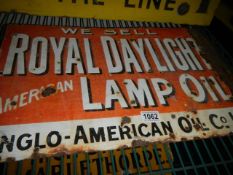 An old metal Royal Daylight Lamp Oil enamel advertising sign.