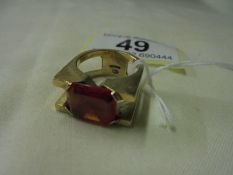 A 9ct gold ring set large red stone, size L, 9.5 grams.