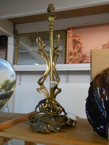 A mid 20th century cast brass table lamp base, 50 cm tall.