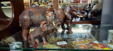 A resin mother elephant & infant & another elephant
