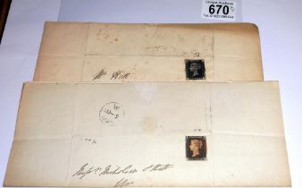 Two mid 19th century penny black postage stamps on postmarked envelopes.