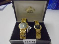 A boxed pair of ladies/gents Medici 18ct gold plated wrist watches.