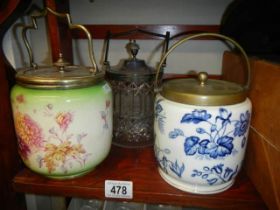 Three good biscuit barrels - two ceramic and one glass.