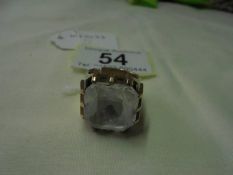 A large 9ct gold ring set clear stone, size M, 14.4 grams.