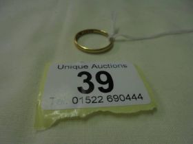 A 22ct gold wedding ring, size S, 2.8 grams.