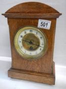 A good oak mantel clock in working order.