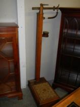 A set of early 20th century medical scales with height ruler and weights. COLLECT ONLY.